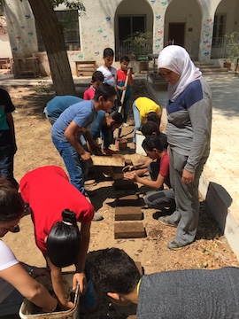 Learning about ancient Amarna: making mudbricks, Egypt