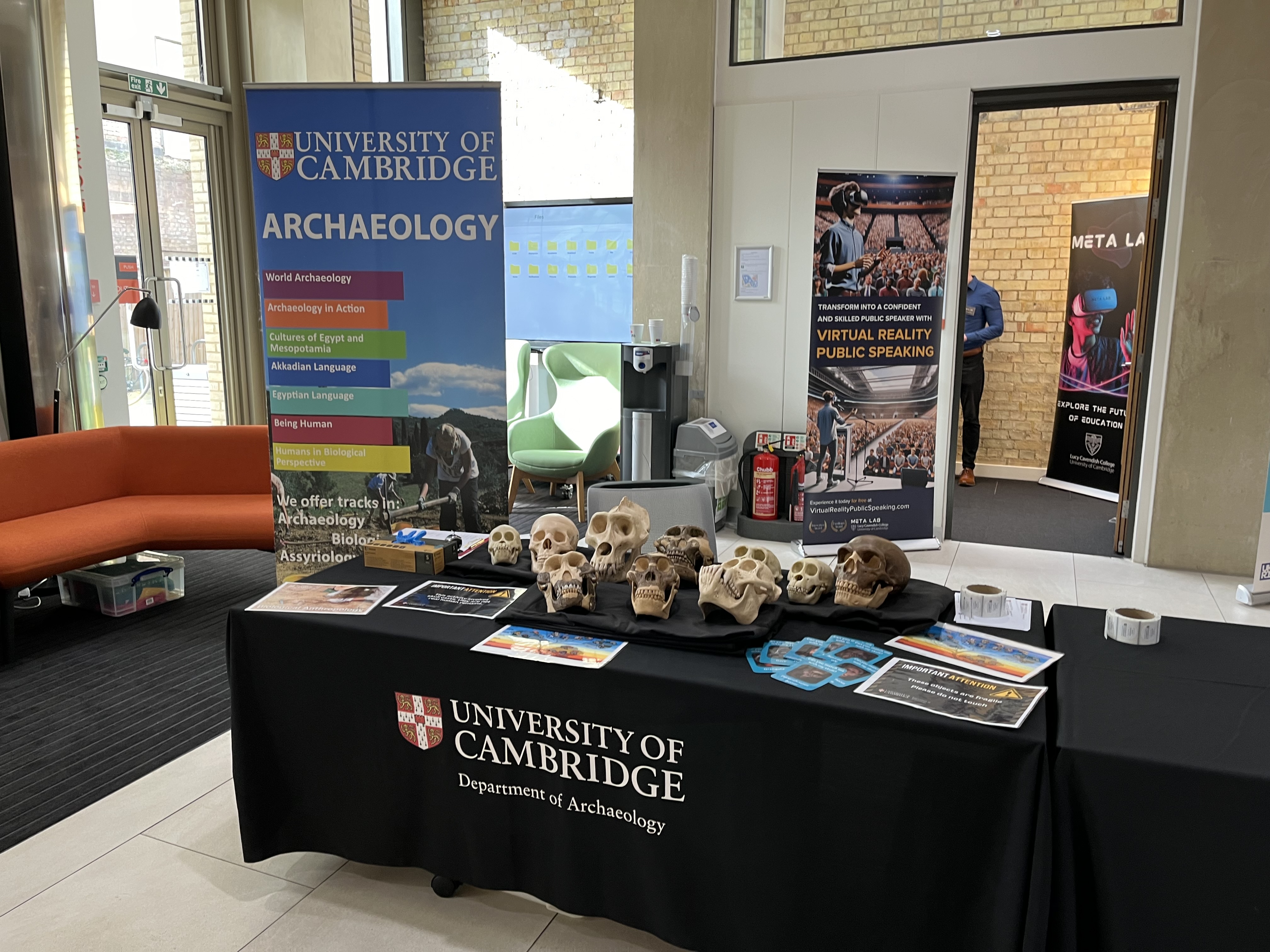 A stall at Cambridge Festival with colourful roller banners.