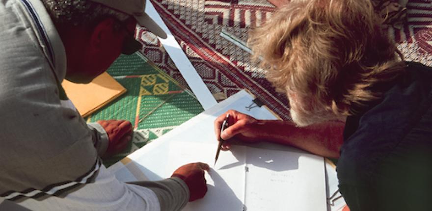 Egyptian and British colleagues collaborating on site management resources, Amarna